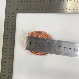 Detail shot of orange and white braided rope roll with mm rulers for scale measurement