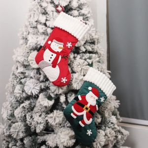 Large embroidered Christmas stockings set with Santa and snowman on a white Xmas tree