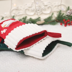 Large festive Christmas stockings in red and green with snowman embroidery and soft plush cuff
