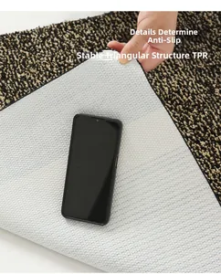Detailed view of non-slip TPR triangular bottom texture on a heavy-duty entrance mat