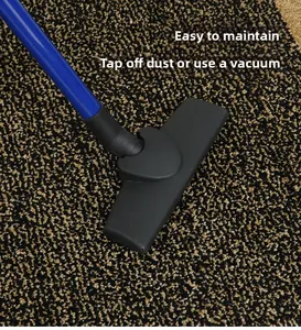 Vacuum cleaner cleaning durable dark textured doormat with beige dots for easy maintenance
