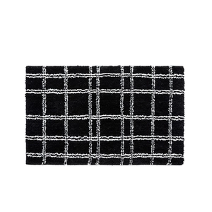 Black and white checkered plush bathroom mat with non-slip backing and soft texture