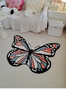 Close-up of thick plush butterfly rug with pink and blue blocks in a cozy home setting