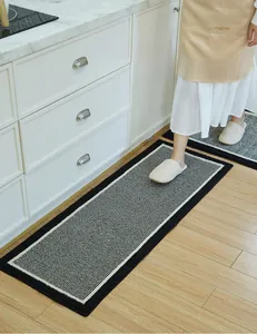 Detail view of L-shaped setup for striped absorbent kitchen rugs with non-slip backing