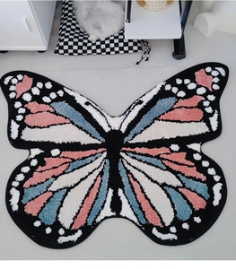 Detailed top view of the thick butterfly rug showing soft plush texture and color contrast