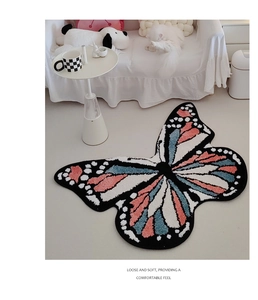 Macro shot of colorful butterfly shaped rug showing soft plush texture and thick fibers