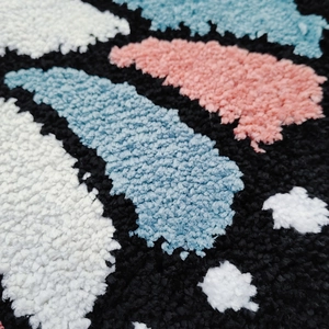 Plush butterfly cream style bedroom rug with thick colorful geometric tufted pattern