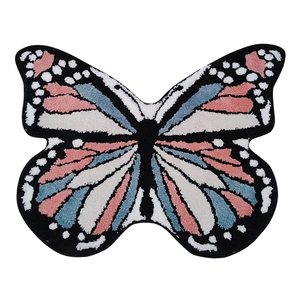 Plush butterfly-shaped rug with pink and blue patterns for bedroom or living room decor