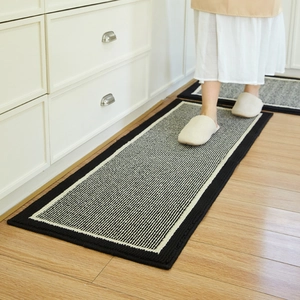 Modern black and white striped kitchen mat on wooden floor with anti-slip backing