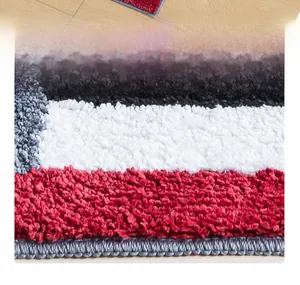 Close-up of thick plush retro striped bedside rug with soft shaggy texture and secure edges