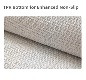 Detailed close-up of TPR non-slip backing with geometric anti-skid pattern for rugs