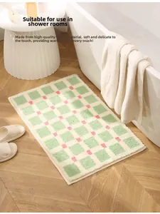 Detail of soft flocked texture on green and white checkered bath mat for bathroom