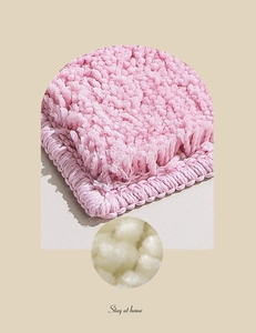 Close-up of pink absorbent bathroom mat showing soft plush fibers and woven edges