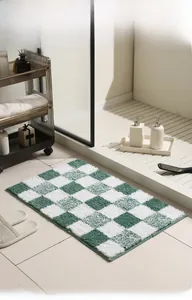 Detail of green checkerboard bath mat with thick absorbent microfiber texture