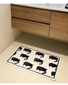 Detail showing high-density flocking texture and cartoon black cat patterns on the bath mat