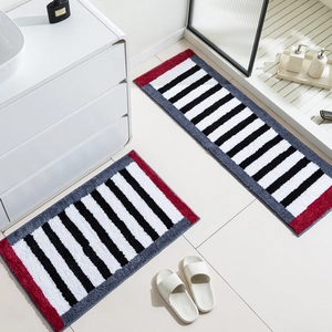 Thick plush black and white striped bedside rug with non-slip absorbent fibers