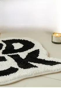 Detail showing the thick tufted texture and soft fiber of this minimalist bath mat