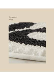 Macro shot of minimalist bath mat texture featuring thick short pile and neat machine edging