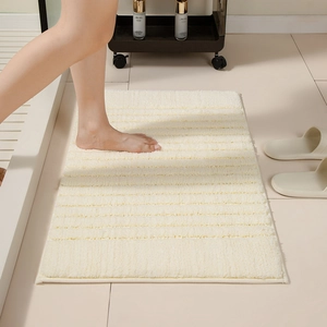 Absorbent rectangular bathroom mat with striped texture in cream white for home