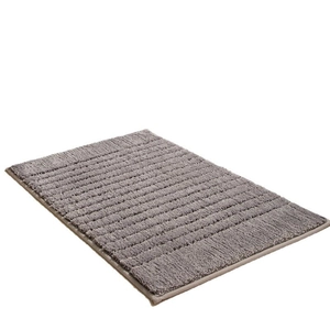 Absorbent grey striped bathroom mat with anti-slip thick texture on a white background