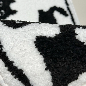 Thick black and white cat pattern flocking bathroom mat with soft tufted texture
