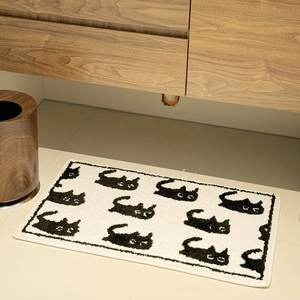 Thick flocked rectangular bathroom mat with black and white cartoon cat pattern