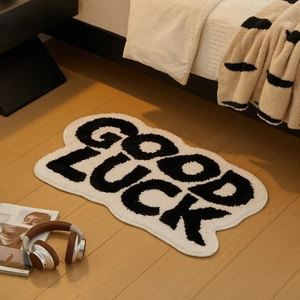Absorbent 'Good Luck' cloud-shaped bathroom mat on wooden floor for modern home decor