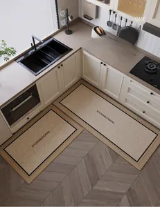 Detail of waterproof beige kitchen mat set with vintage borders and non-slip texture