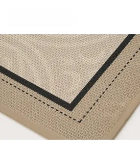 Detail of linen-textured woven kitchen mat with durable weave and black line borders
