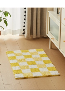 Detailed plush texture of the yellow and white checkered absorbent bathroom floor mat