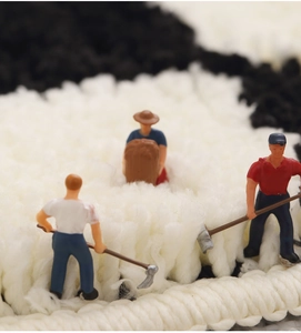 Macro detail of high-density thick shag carpet fibers with creative miniature scene