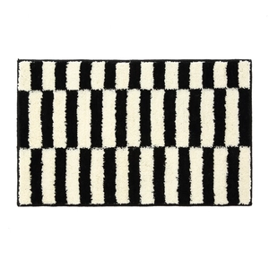 Absorbent minimalist black and white striped bath mat with thick anti-slip texture