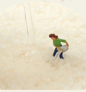 Macro shot showing high water absorption on the thick white plush bathroom rug texture
