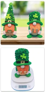 Detail of St. Patrick's Day gnomes with green sequins, orange beards and clover charms