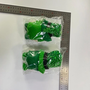 Detailed scale measurement of two green St. Patrick's Day gnomes with sequins and shamrocks