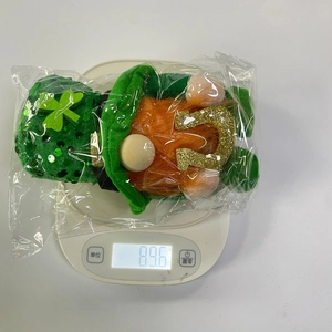 Macro view of St. Patrick's Day gnome with green sequined hat and orange beard