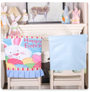 Detail of Easter chair cover with Happy Easter print, rabbit motifs and blue polka dot skirt