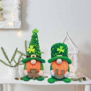 St. Patrick's Day gnome pair with green sequin hats holding golden clover and horseshoe