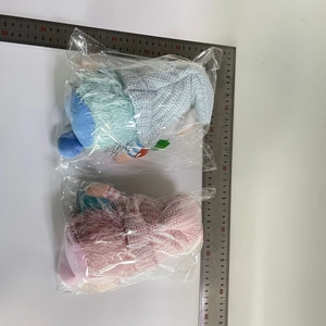 Detailed view of handmade Easter gnomes plush toys with measuring ruler scale