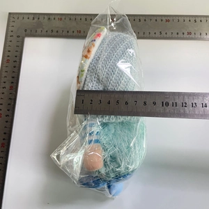 Close-up of Easter faceless bunny plush measuring 10cm wide in clear plastic packaging