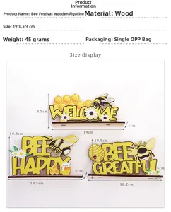 Detailansicht der Holz-Bienenschilder mit 'BEE HAPPY' Schriftzug und Wabenmustern