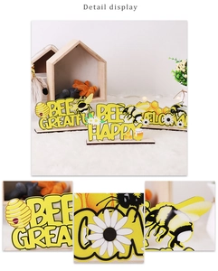 Detail display of Bee Happy wooden desktop ornaments with daisy floral motifs
