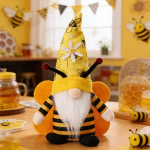 Detailed close-up of a plush bee gnome decoration with yellow stripes and wings
