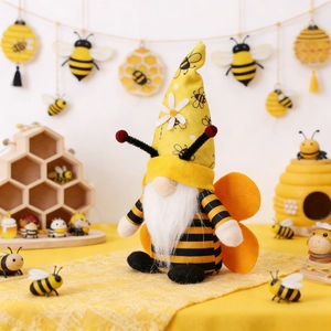 Detail of bee gnome plush with striped body, orange wings and daisy flower hat