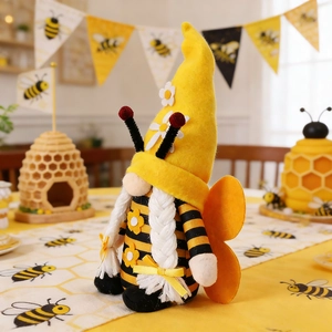 Detailed plush bee gnome with striped hat, orange wings and white braids for home decor