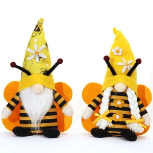 Pair of striped bee gnomes with wings and daisies for spring festival decoration
