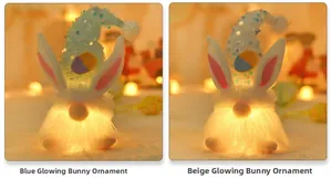Close-up of blue and beige light-up gnome plush toys with sequins and warm festive bokeh