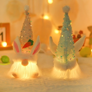 Light-up Easter Gnomes with sequined rabbit ears and carrots in a warm glowing display