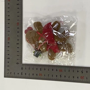 Detailed close-up showing the size dimensions of the gingerbread man plush ornament