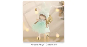 Detail of green fairy angel ornament with rabbit ears and gold star on white branch